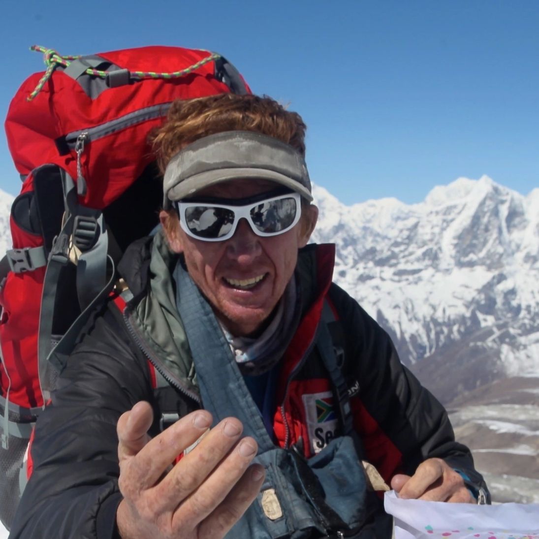 A mountaineer in a snowy landscape, from Tribe Coffee’s existing website