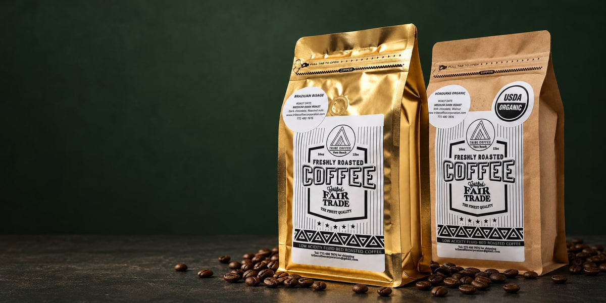 Tribe Coffee gold and kraft bags with roasted coffee beans against a dark green background